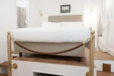 a hammock bed in a bedroom with a fireplace at Domus Vitra 23 in Rome