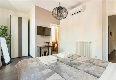 a bedroom with a large bed in a room at Azzurra Guest House Vaticano in Rome