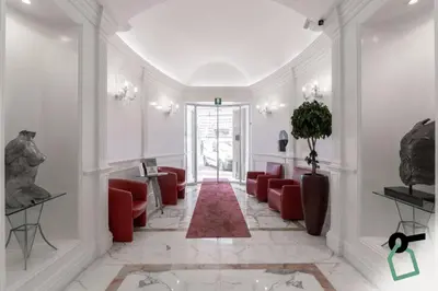 a lobby with red chairs and a red rug at HOTIDAY Room Collection - Roma Porta Pia in Rome