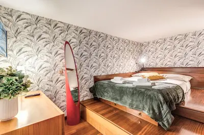a bedroom with a bed and a surfboard against a wall at Residenza Coppedè in Rome