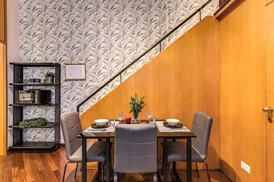 a dining room with a table and chairs at Residenza Coppedè in Rome