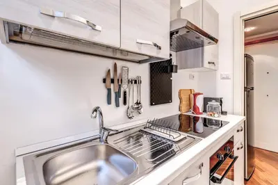 a kitchen with a sink and a counter at Residenza Coppedè in Rome