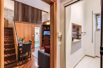 a small apartment with a dining room and a living room at Residenza Coppedè in Rome