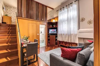 a living room with a couch and a table at Residenza Coppedè in Rome