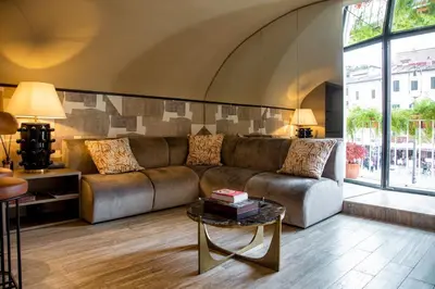 a living room with a couch and a table at CadensPlace - Overlooking Piazza Navona by dbalconycollection in Rome
