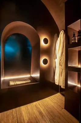 a bathroom with a metal door and a shelf at CadensPlace - Overlooking Piazza Navona by dbalconycollection in Rome