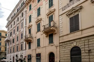 a large building with many windows on a street at Via Vespasiano Private Apartment in Rome