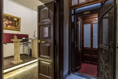 an entrance to a room with a wooden door at Pantheon Caesar Relais in Rome