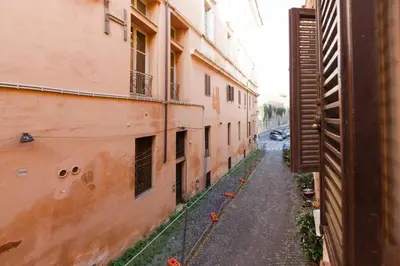 an alley between two buildings in an alley way at Cozy apartment in Rome