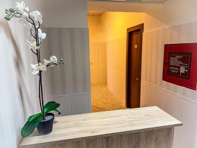 a bedroom with a bed and a large window at Hotel Giada Roma in Rome