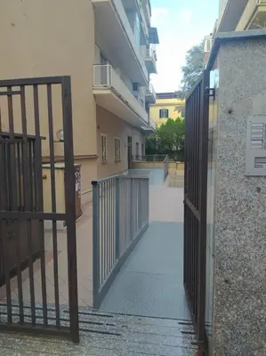 an entrance to a building with a metal gate at La Casetta di Monteverde in Rome