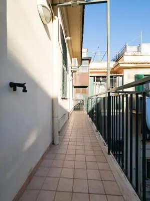 a cat sitting on a balcony of a building at Home Holiday Rome - Basilica San Pietro in Rome