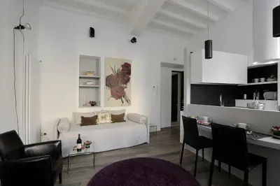 a white living room with a white couch and chairs at Antiche Residenze Romane Pantheon in Rome