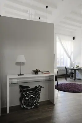 a motorcycle parked under a table in a room at Antiche Residenze Romane Pantheon in Rome