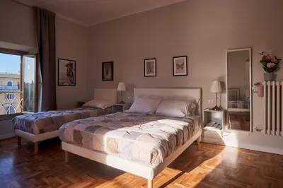 a bedroom with two beds and a window at Bonavista inn in Rome