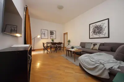 a living room with a couch and a table at Giant Borghese Apartment in Rome