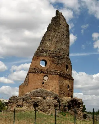 an old brick tower with a hole in the top at A casa di zia Anna in Rome