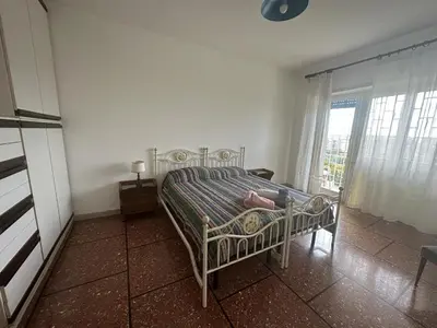 a bedroom with a bed in a room with a window at A casa di zia Anna in Rome