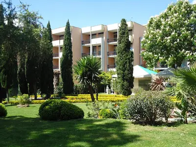 a large apartment building with trees and a garden at Domus Aurelia Studio Apartments in Rome