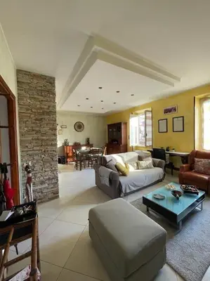 a living room with a couch and a table at Roma Battistini 66 Apartment, near Vatican City in Rome