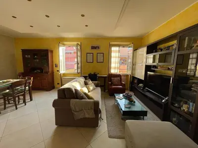 a living room with a couch and a table at Roma Battistini 66 Apartment, near Vatican City in Rome