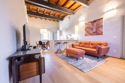 a living room with a couch and a table at Titta's Dream by BuddyRent in Rome