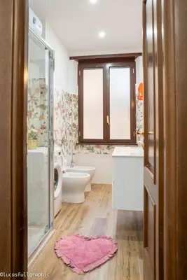 a bathroom with a toilet and a sink and a shower at Sophie's Choice 2 in Rome