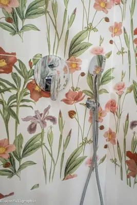 a shower in a bathroom with a floral wallpaper at Sophie's Choice 2 in Rome