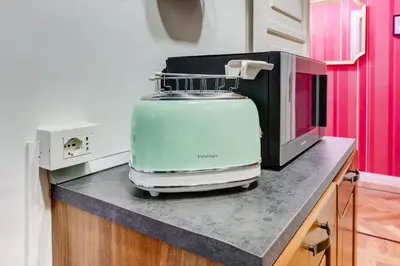 a appliance sitting on a counter next to a microwave at Salotto Trastevere in Rome