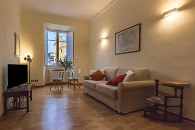 a living room with a couch and a table at Domus 1886 (Quartiere Prati) in Rome