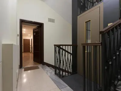 a hallway of a house with a stairway at Domus 1886 (Quartiere Prati) in Rome