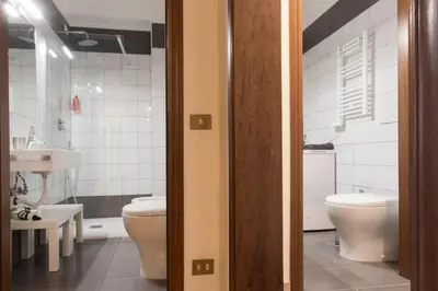 a bathroom with a toilet and a sink at Domus 1886 (Quartiere Prati) in Rome