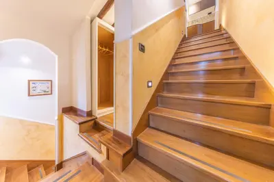 a staircase in a home with wooden floors at AC21 - Panoramic Studio in Rome