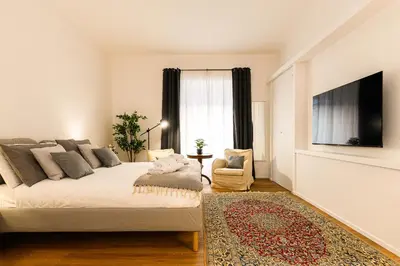 a bedroom with a large bed and a television at Central near Vatican by NDP rent in Rome