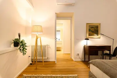 a room with a bedroom with a desk and a bed at Central near Vatican by NDP rent in Rome