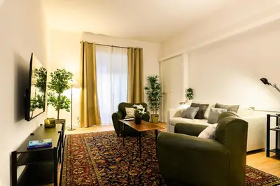 a living room with a couch and a table at Central near Vatican by NDP rent in Rome