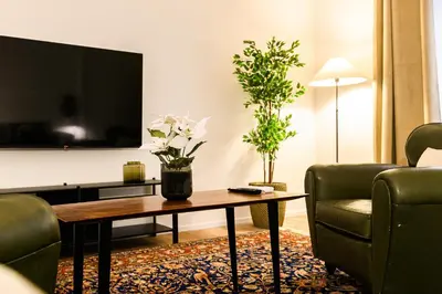 a living room with a coffee table and a tv at Central near Vatican by NDP rent in Rome
