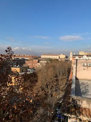a view of a city with trees and buildings at Il Nido apartment Roma, Attico ostiense in Rome