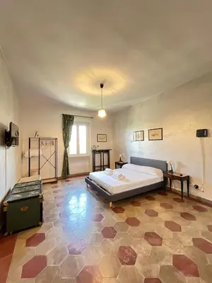 a bedroom with a large bed in a room at Il Nido apartment Roma, Attico ostiense in Rome
