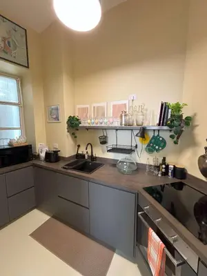 a kitchen with a sink and a counter at Trevi My Charming Holiday Home, at Trevi Fountain in Rome