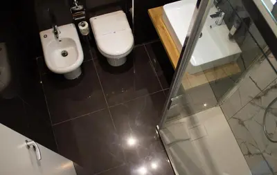 a bathroom with a toilet and a sink at Michelangelo Vatican Rooms in Rome