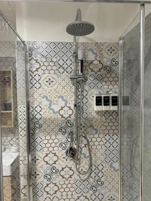 a shower in a bathroom with a glass door at Betterplace in Rome