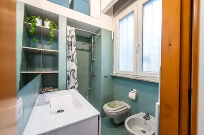 a bathroom with a sink and a toilet at Casa Cate in Rome
