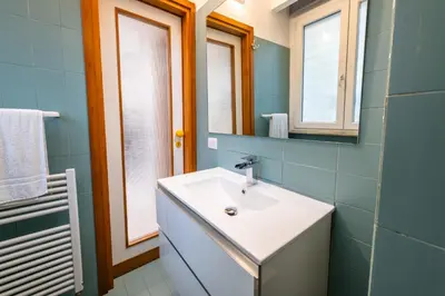a bathroom with a sink and a mirror at Casa Cate in Rome