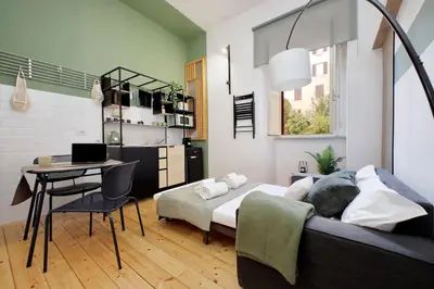 a bedroom with a bed and a desk with a laptop at Gazometro Apartment SelfCheck-in in Rome