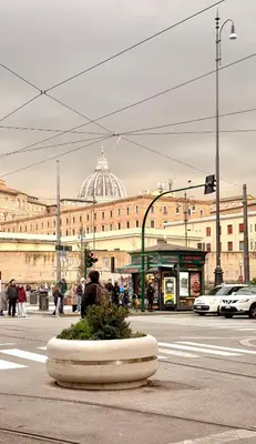 a building with a dome on top of it at San Pietro Suite - Vatican City in Rome