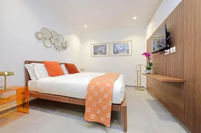 a bedroom with a bed and a television in it at YCH-Casa Indipendente in zona Prati in Rome
