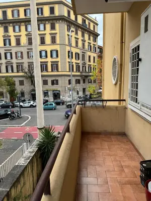 a balcony with a view of a building at Civico Nove al Colosseo in Rome