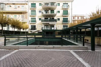 a pool of water in front of a building at Studio Margherita in Rome