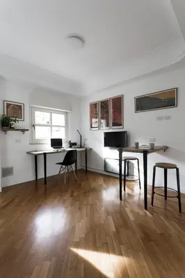 a living room with two desks and two chairs at Studio Margherita in Rome